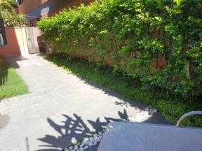 CASA 102: Varanda e Jardim